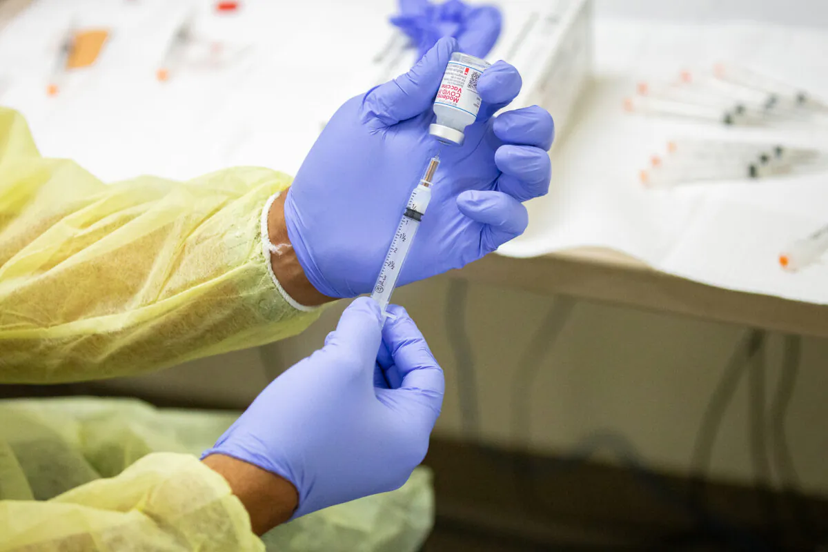A dose of the Moderna COVID-19 vaccine is prepared in Orange, Calif., in a file image. (John Fredricks/The Epoch Times)