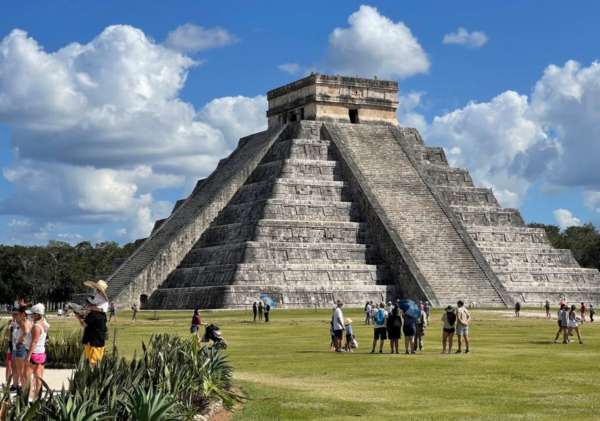 Tourists wearing face masks are seen at Chichen Itza archaeological site in Mexico on March 5, 2021. (Daniel Slim/AFP via Getty Images)