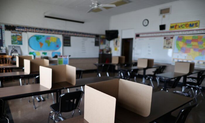 Social distancing dividers for students are seen in a classroom at St. Benedict School in Montebello, near Los Angeles, Calif., on July 14, 2020. (Lucy Nicholson/Reuters)