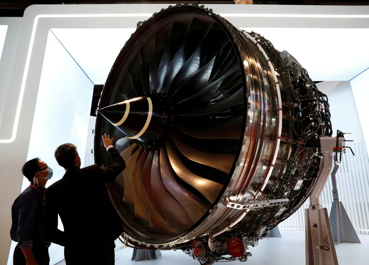 People look at Rolls Royce's Trent Engine displayed at the Singapore Airshow in Singapore, on Feb. 11, 2020. (Edgar Su/Reuters)