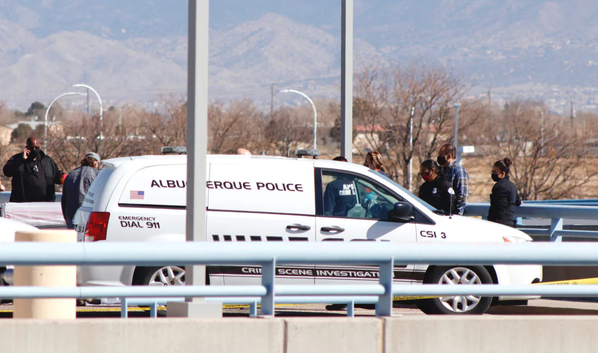 Police investigate where four bodies were found on March 5, on the upper level of the parking garage at the Albuquerque International Sunport airport in Albuquerque, N.M., on March 10, 2021. (Matthew Reisen/The Albuquerque Journal via AP)