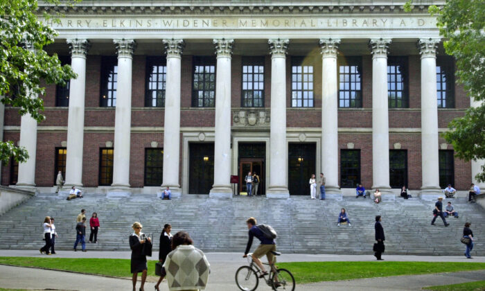 Students pass in front of Harvard's Widener Library in Cambridge, Massachusetts, on Oct. 10, 2003. (William B. Plowman/Getty Images)