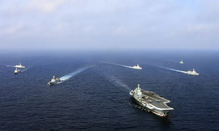 China's operational aircraft carrier, the Liaoning (front), sailing with other ships during a drill at sea on April 2018. A flotilla of Chinese naval vessels held a "live combat drill" in the East China Sea, state media reported early April 23, 2018, the latest show of force by Beijing's burgeoning navy in disputed waters that have riled neighbors. (AFP via Getty Images)