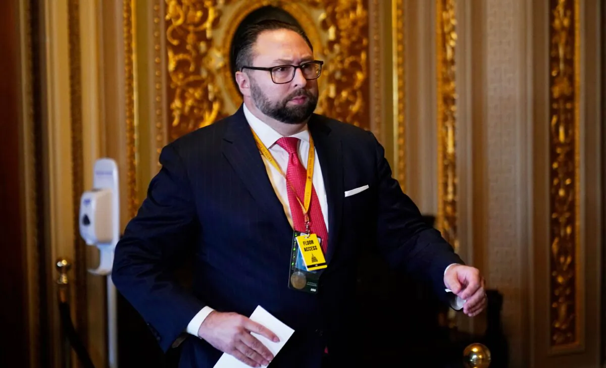 Jason Miller, Senior Adviser to the Trump 2020 reelection campaign, walks in the Capitol during the second impeachment trial of former President Donald Trump in the Senate, at the U.S. Capitol in Washington on Feb. 9, 2021. (Andrew Harnik/POOL/AFP via Getty Images)