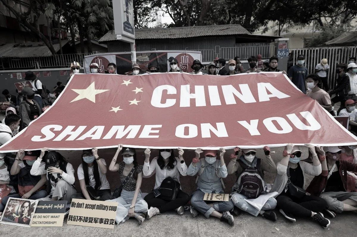 Demonstrators protest outside the Chinese embassy against the military coup in Yangon, Burma, on Feb. 19, 2021. (Stringer/Reuters)