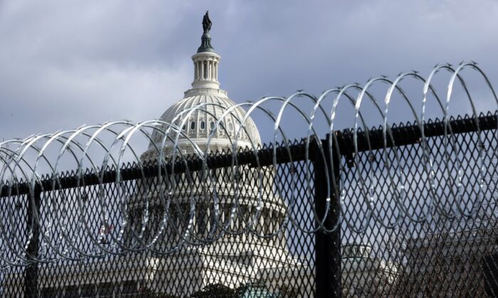 An eight-foot-tall steel fence topped with concertina razor wire circles the U.S. Capitol in Washington on Jan. 29, 2021. (Chip Somodevilla/Getty Images)
