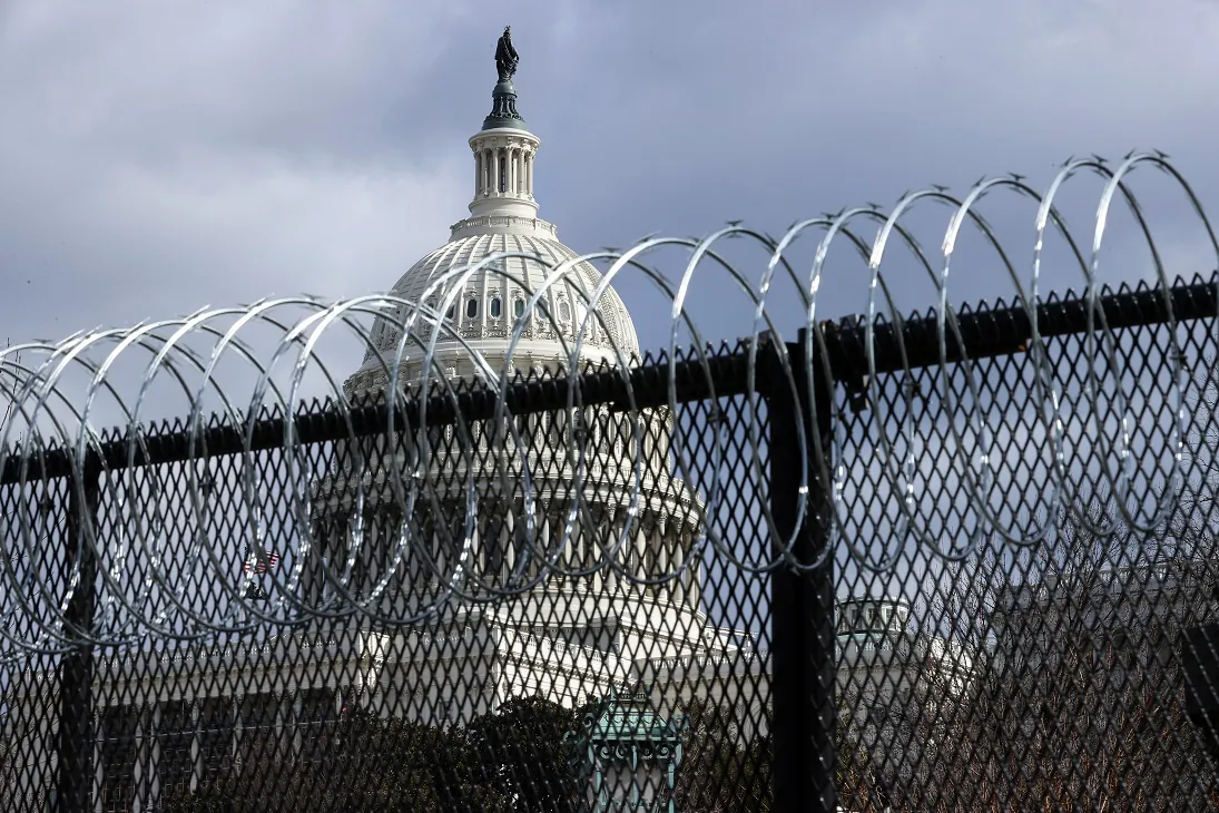 An eight-foot-tall steel fence topped with concertina razor wire circles the U.S. Capitol in Washington on Jan. 29, 2021. (Chip Somodevilla/Getty Images)