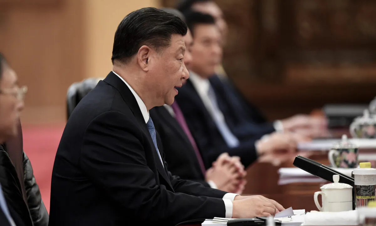 Chinese Communist Party leader Xi Jinping talks to Japan's Prime Minister Shinzo Abe (not pictured) during a meeting at the Great Hall of the People in Beijing, China, on Dec. 23, 2019. (Noel Celis-Pool/ Getty Images)