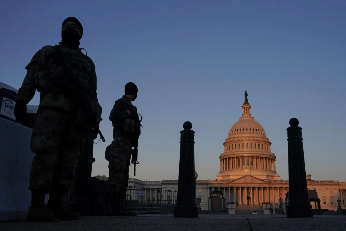 National Guard members stand their posts around the Capitol at sunrise in Washington, D.C., on March 8, 2021. (Carolyn Kaster/AP Photo)