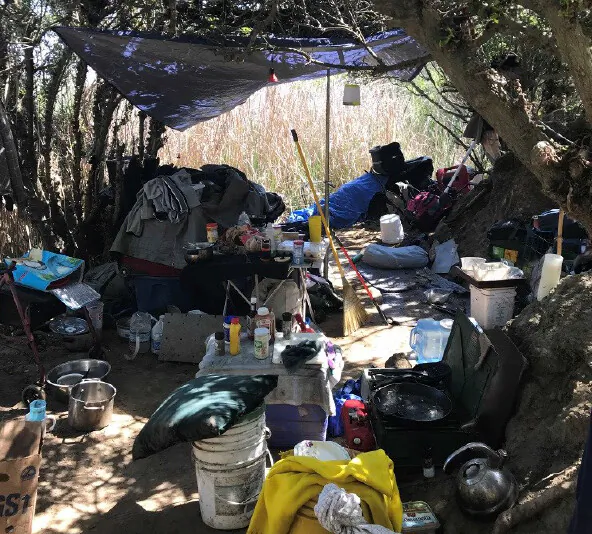 A group of homeless people living at Harriet Wieder Park and Bolsa Chica Conservancy were removed by Huntington Beach police’s homeless task force on March 10 during a clearing operation. (Courtesy of the Huntington Beach Police Department)