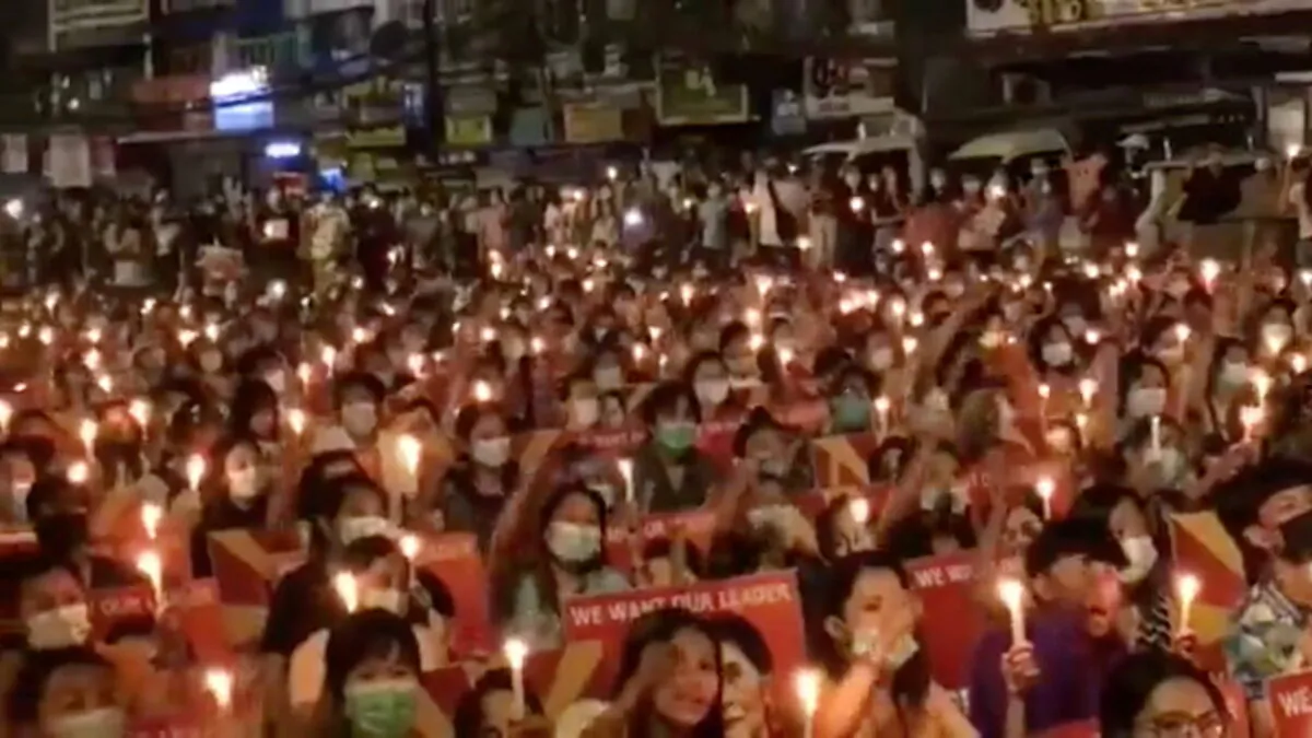 People take part in a candlelight gathering in Yangon, Myanmar, March 12, 2021. (Still image taken from video obtained by Reuters via Reuters)