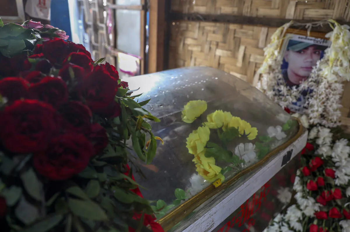 Body of Saw Pyae Naing is placed in a coffin at his home in Mandalay, Burma, on March 14, 2021. (AP Photo)