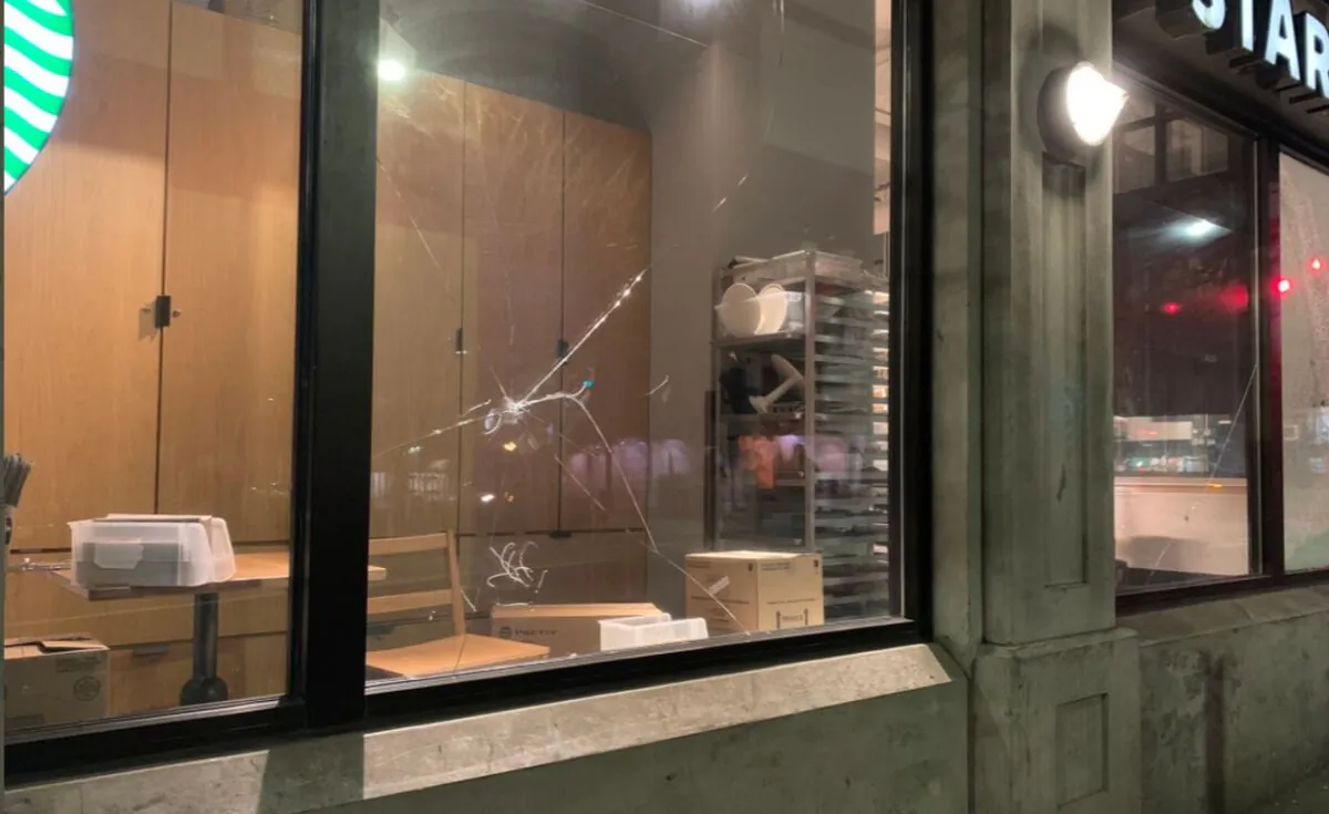 A Starbucks window is smashed during riots and protests marking the one-year anniversary of Breonna Taylor’s death, in Seattle, Wash., on March 13, 2021. (Seattle Police Department)