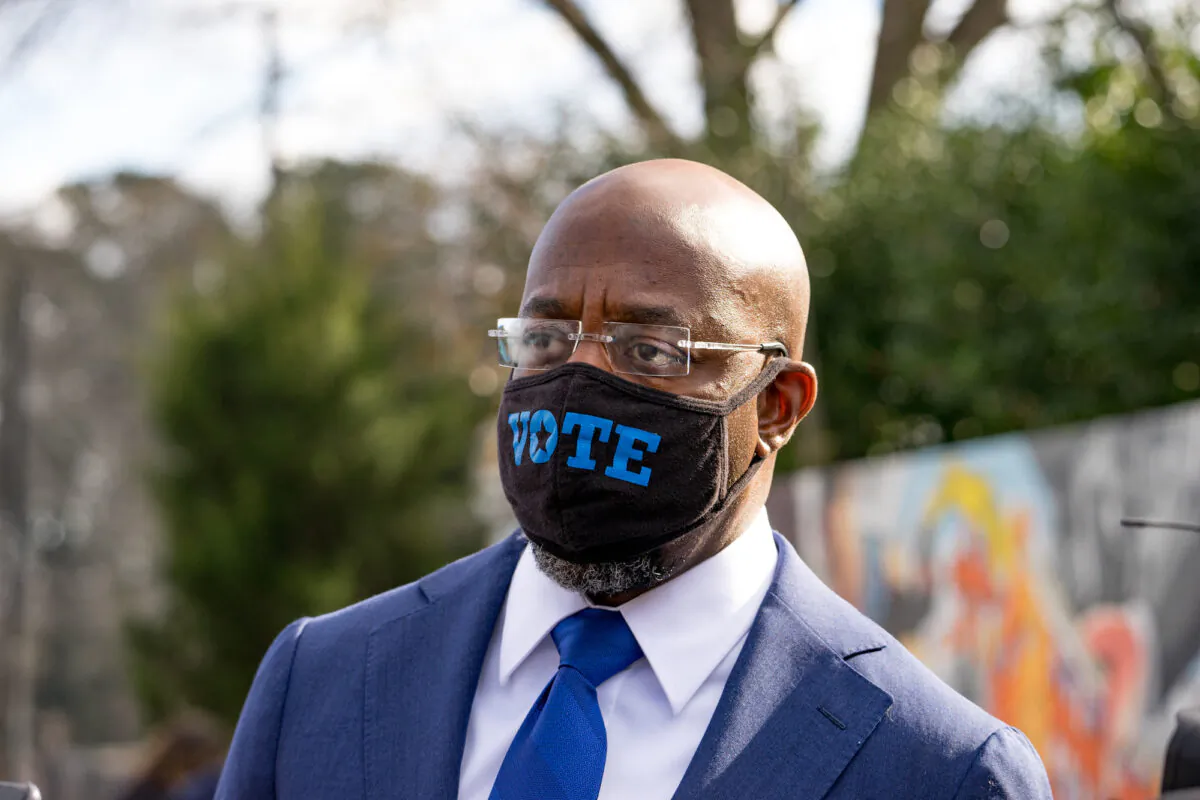 Georgia Democratic Candidate Rev. Raphael Warnock meets with supporters in Marietta, Ga., on Jan. 5, 2021. (Megan Varner/Getty Images)