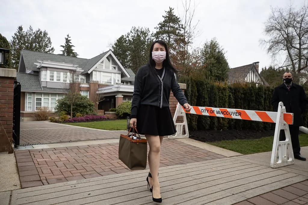 Meng Wanzhou, chief financial officer of Huawei, leaves her home to attend B.C. Supreme Court, in Vancouver, on March 4, 2021. (Darryl Dyck/The Canadian Press)