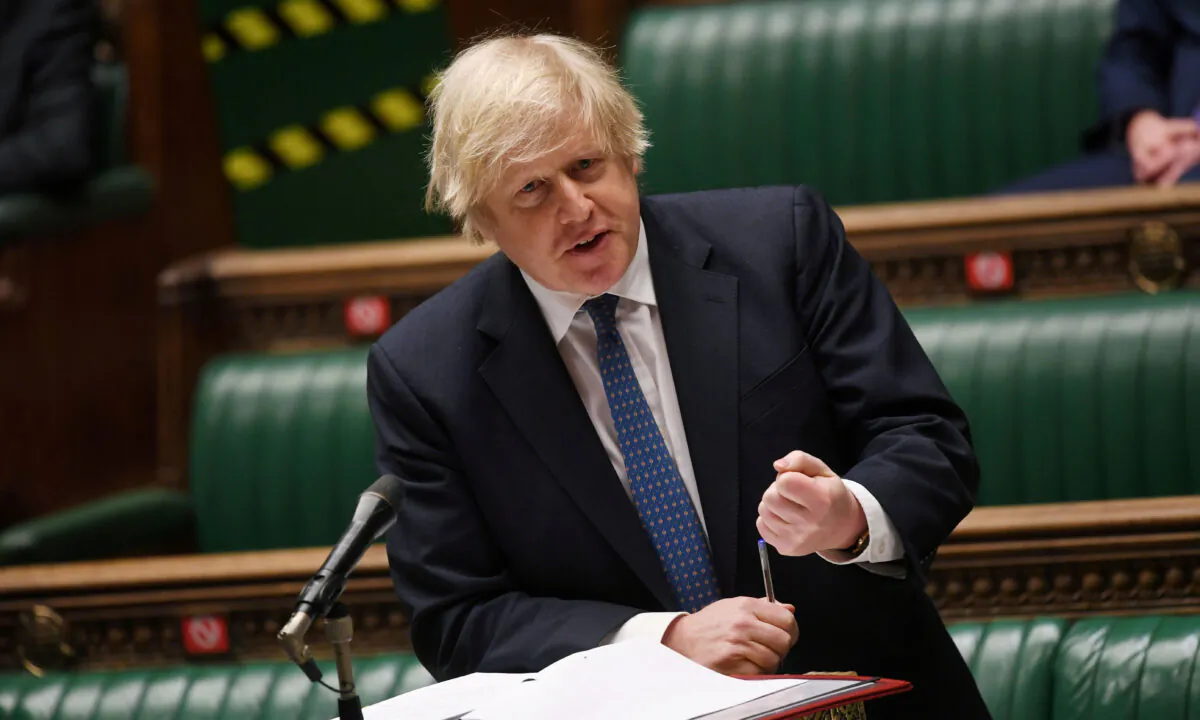 British Prime Minister Boris Johnson speaks during the weekly question time debate at the House of Commons in London on March 10, 2021. (UK Parliament/Jessica Taylor/Handout via Reuters)