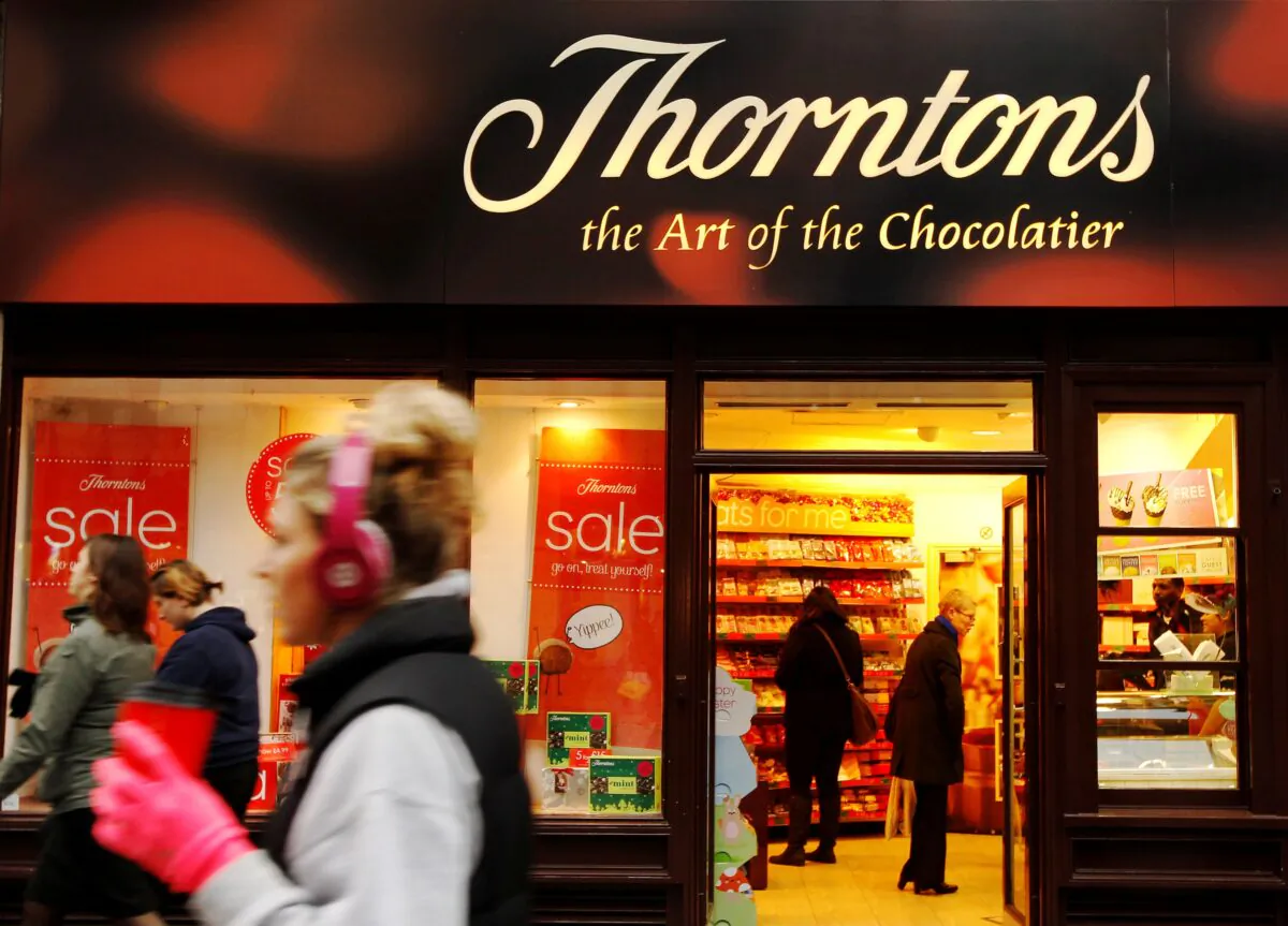 Customers shop at Thorntons chocolate shop on Oxford Street in London, on Jan. 11, 2012. (Luke MacGregor/Reuters)