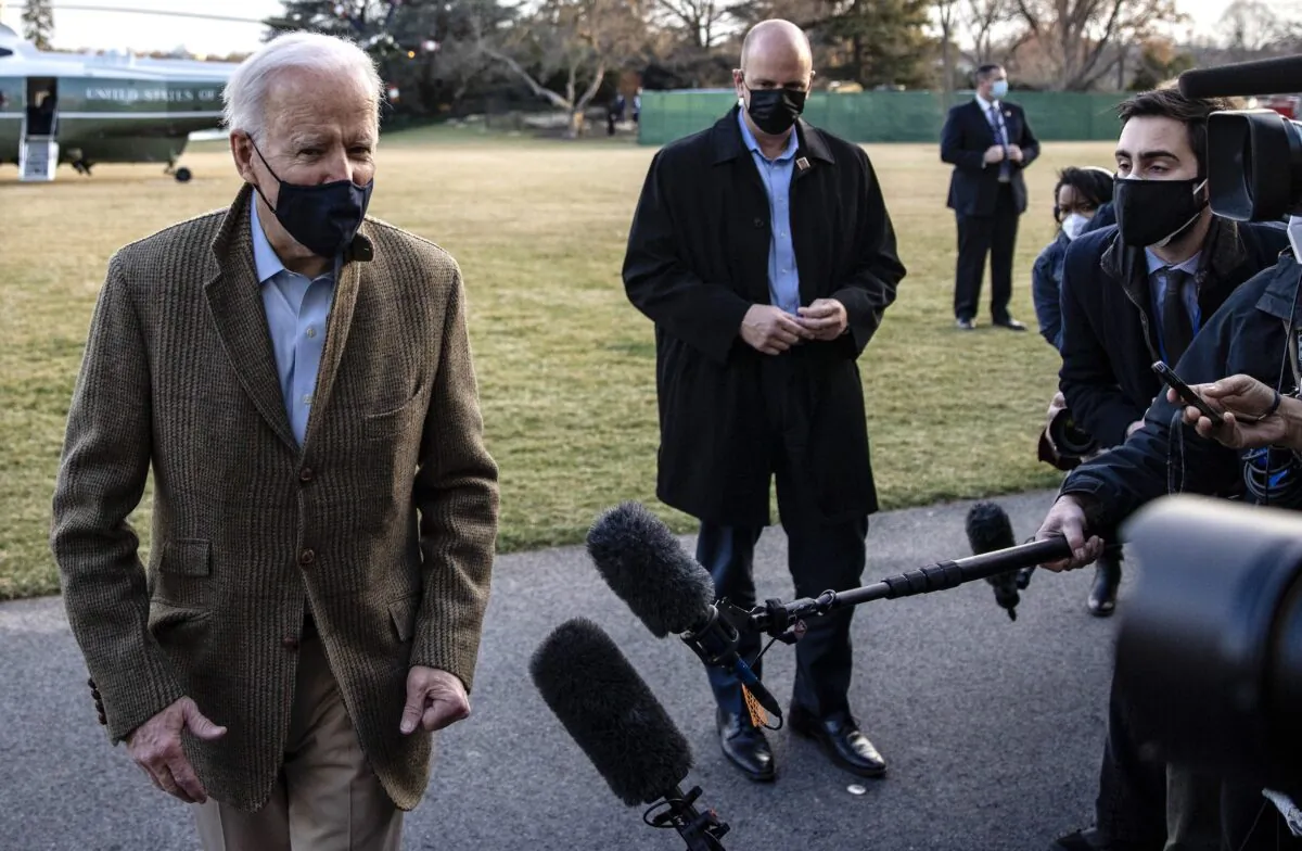 U.S. President Joe Biden stops to talk to the media after stepping off Marine One on the South Lawn of the White House on March 14, 2021. (Tasos Katopodis/Getty Images)