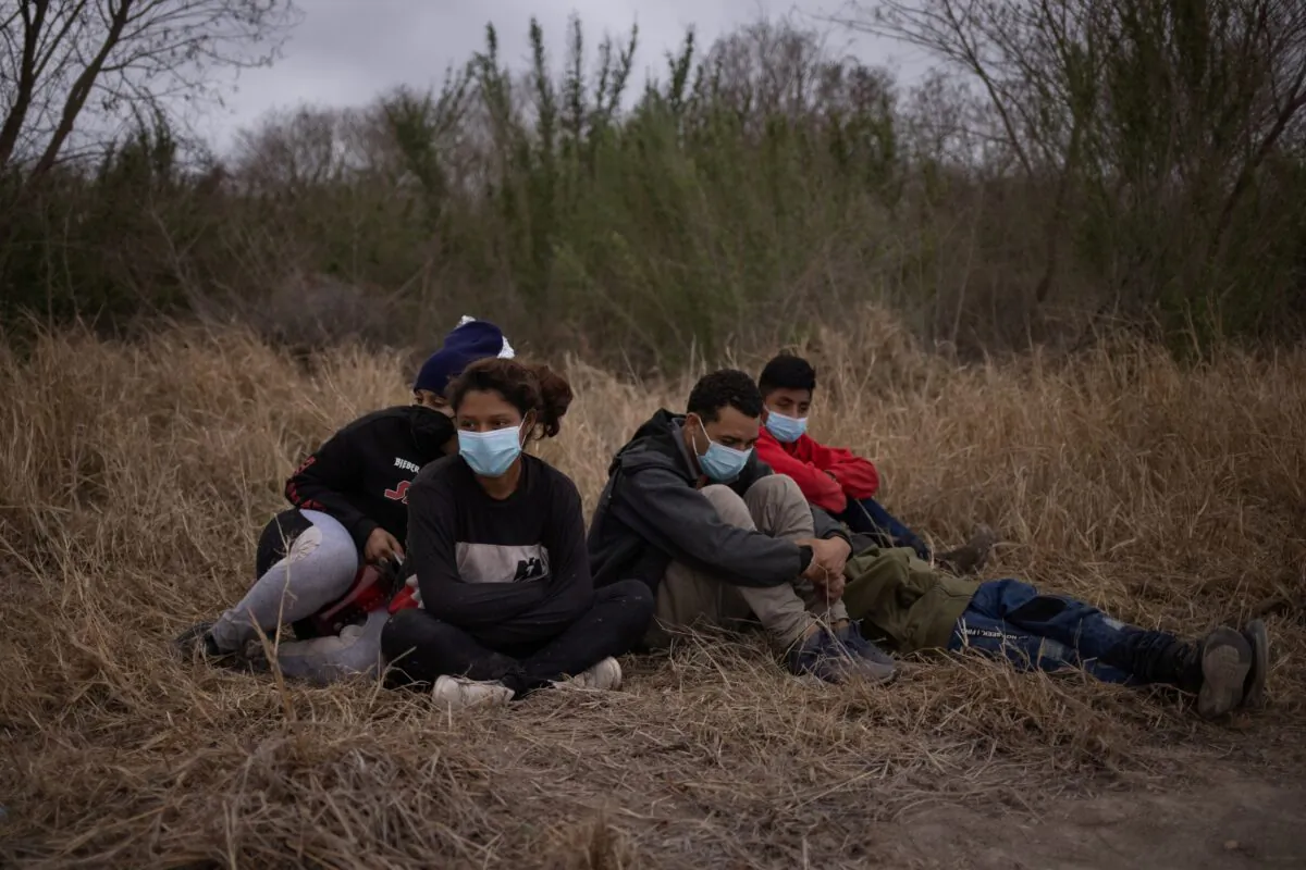 Unaccompanied minors from Central America are separated from other illegal border crossers by U.S. Border Patrol agents after crossing the Rio Grande river into the United States from Mexico on a raft in Penitas, Texas. on March 14, 2021. (Adrees Latif/Reuters)