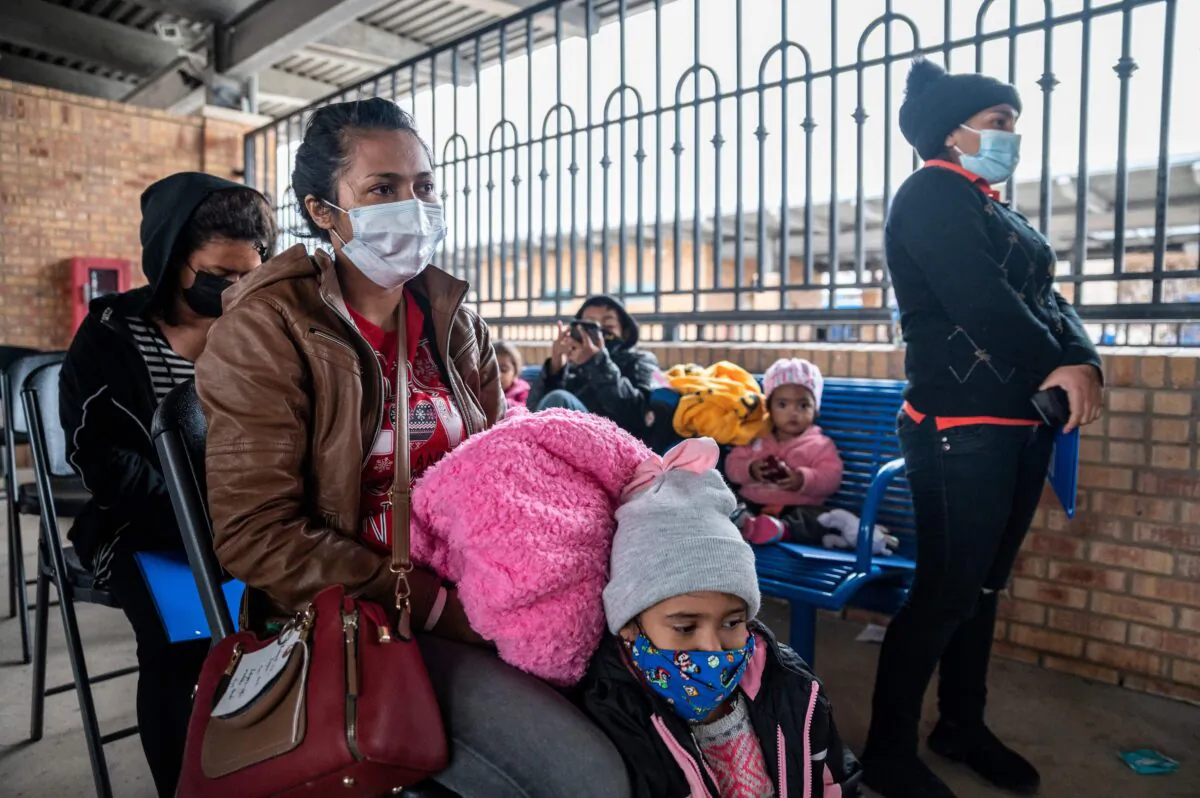 Immigrans wait for their bus at a bus station in Brownsville, Texas before traveling to meet relatives or sponsors, in Brownsville, Texas, on March 2, 2021. (Sergio Flores/AFP via Getty Images)