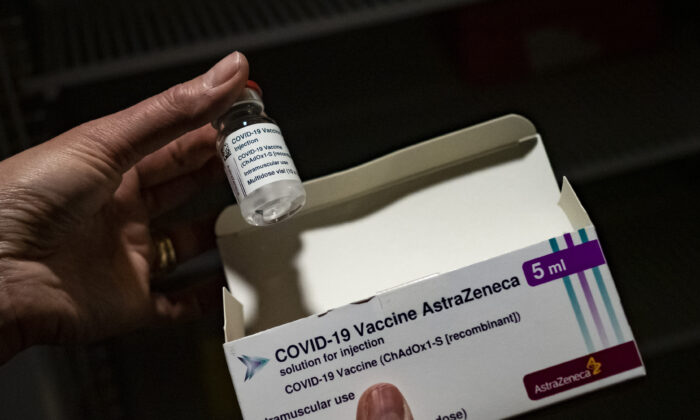 A member of medical staff shows the Oxford-AstraZeneca vaccine at the vaccinodrome set up in the Velodrome stadium in Marseille, France, on on March 15, 2021. (Arnold Jerocki/Getty Images)