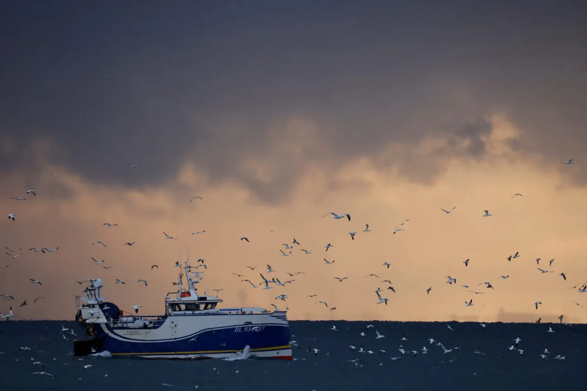 Fishermen fish aboard the Boulogne-sur-Mer based trawler "Manureva" in the North Sea, off the coast of northern France, on Dec. 7, 2020. (Pascal Rossignol/Reuters)