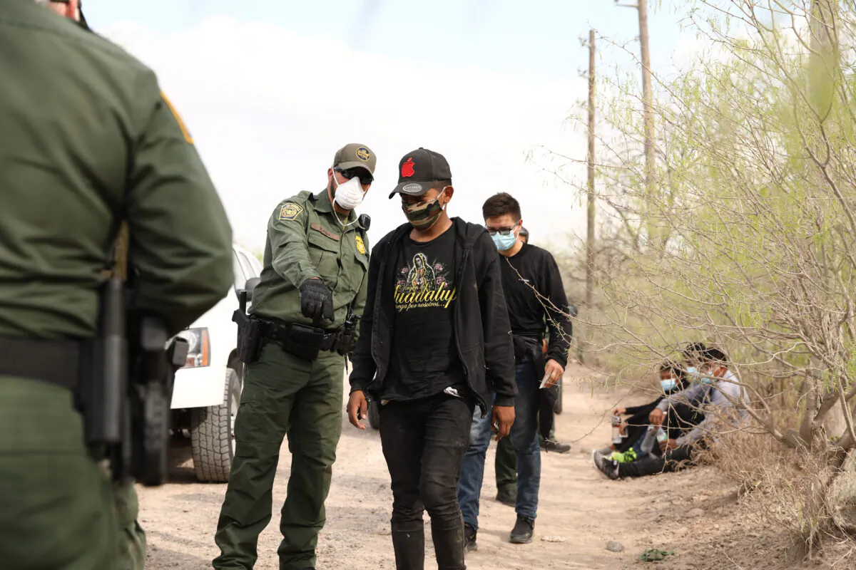 Border Patrol agents arrest seven illegal immigrants who tried to evade capture near Penitas, Texas, on March 15. 2021. (Charlotte Cuthbertson/The Epoch Times)