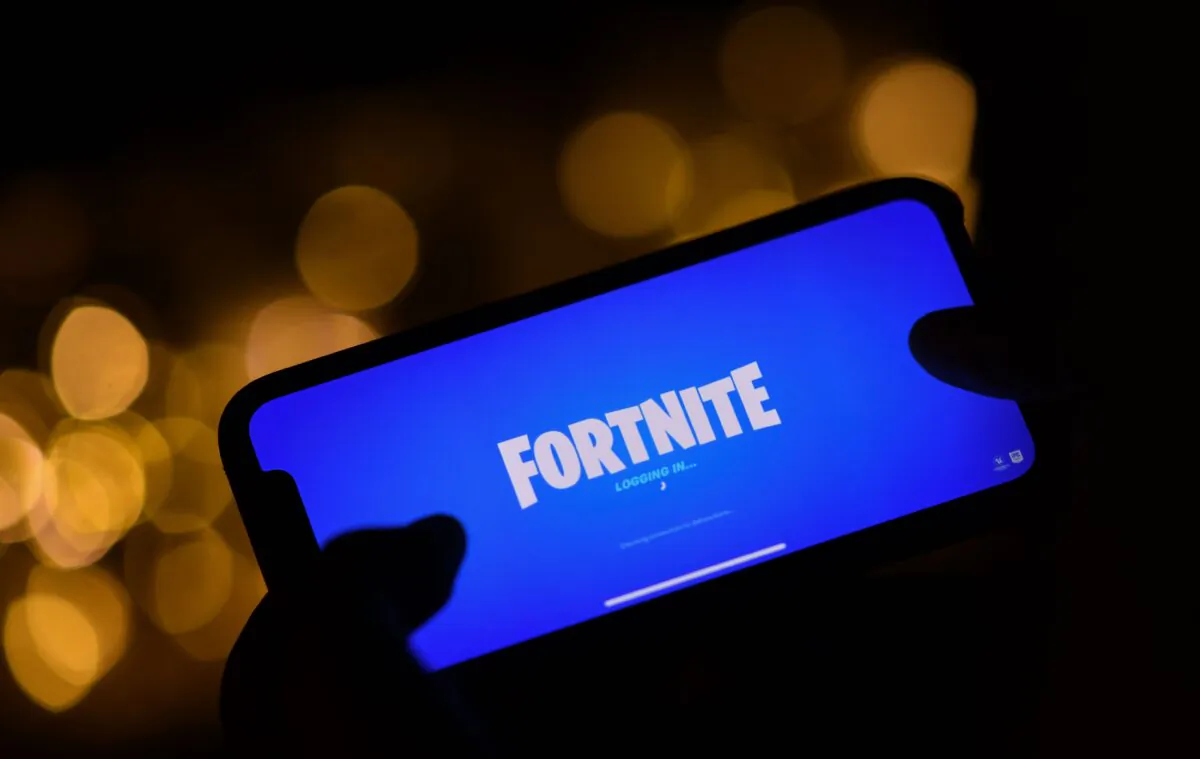 A person logging into Epic Games' Fortnite on their smartphone in Los Angeles on Aug. 14, 2020. (Chris Delmas/AFP via Getty Images)