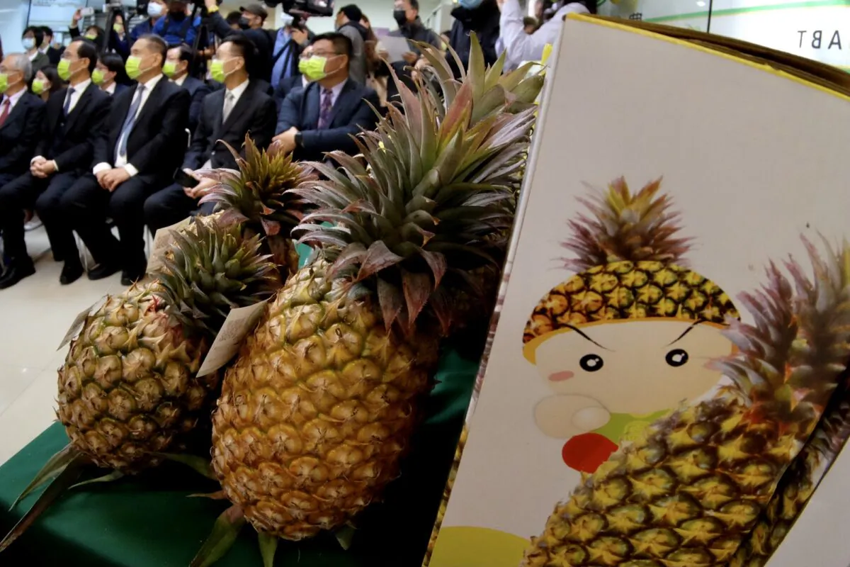 Officials from the Agriculture Bank of Taiwan (back L) attend a press conference to promote domestically grown pineapples and their exports, at the bank's headquarters in Taipei on March 5, 2021. (Sam Yeh /AFP via Getty Images)