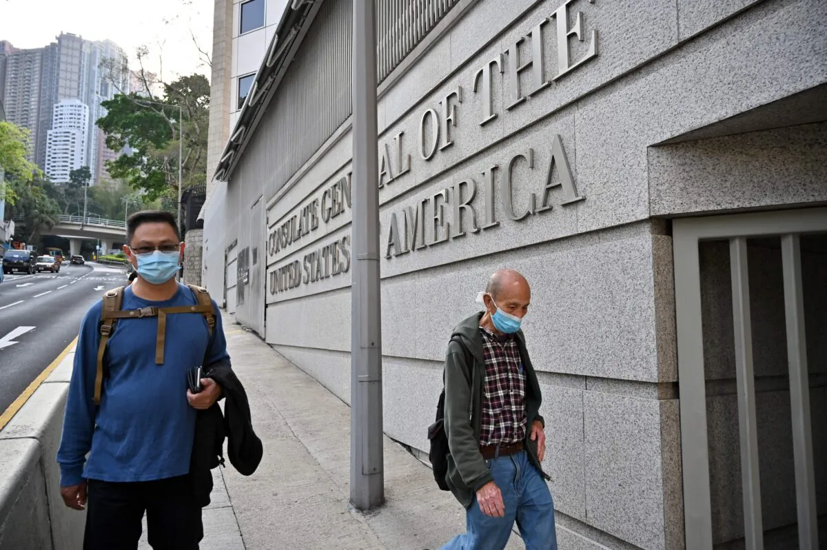 Pedestrians pass the U.S. Consulate building in Hong Kong on March 15, 2021. (Peter Parks/AFP via Getty Images)