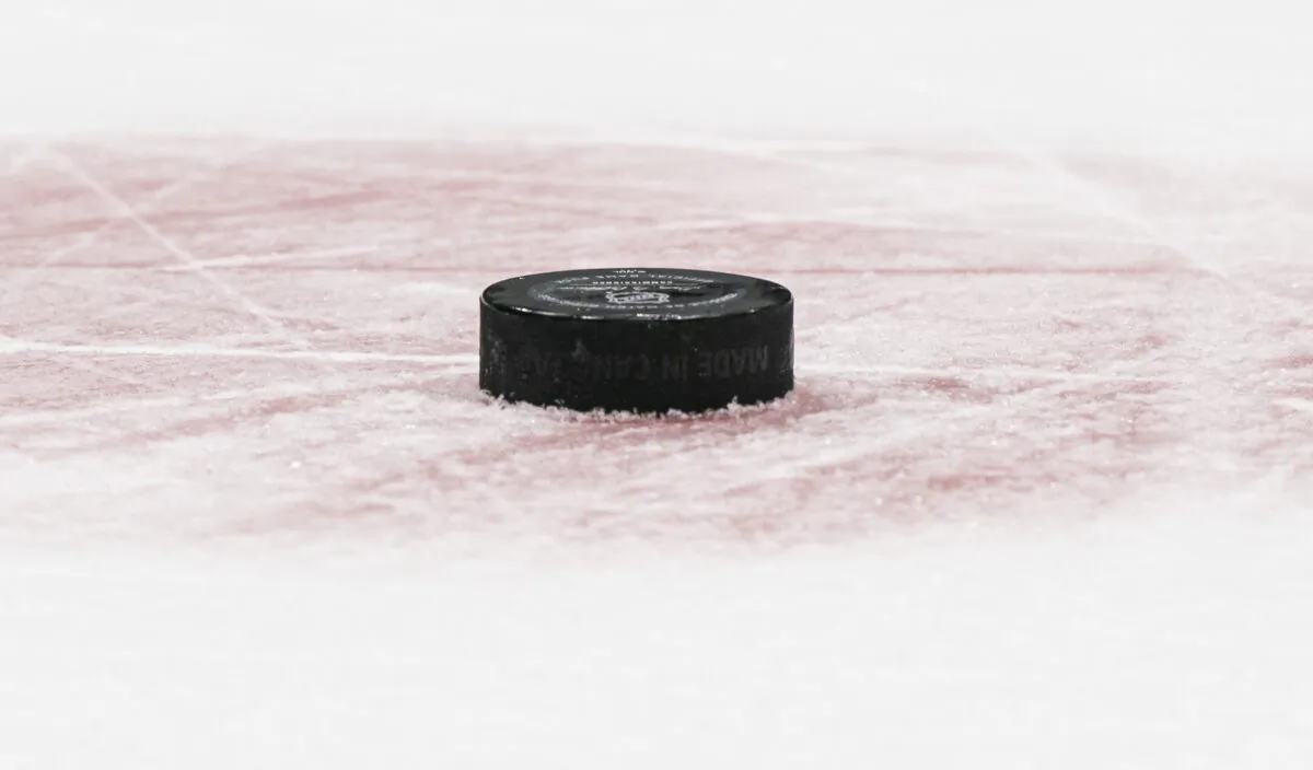 A hockey puck on the ice is shown during NHL game, in a file photo. (Rich Lam/Getty Images)