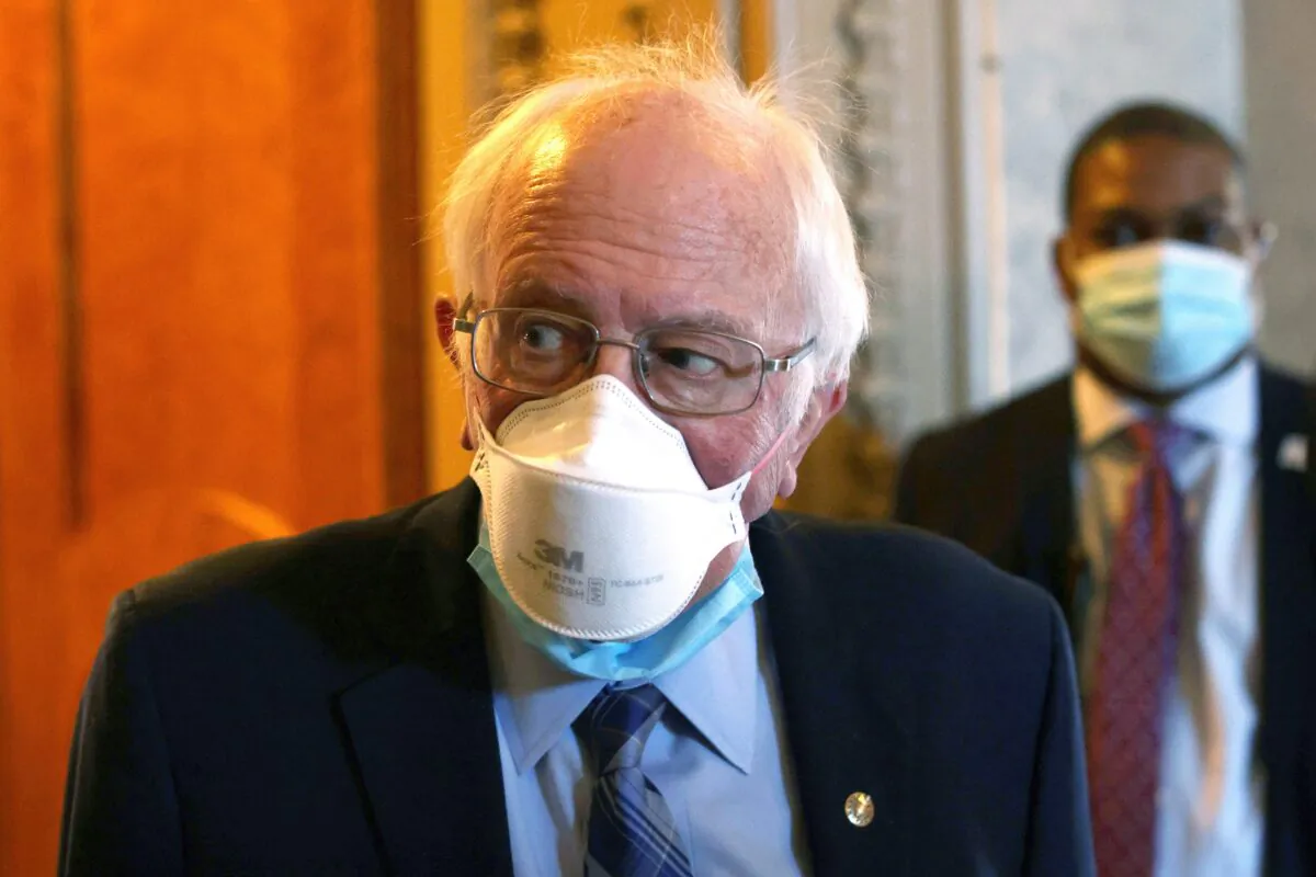 Sen. Bernie Sanders (I-Vt.) passes through a hallway at the U.S. Capitol in Washington on March 5, 2021. (Alex Wong/Getty Images)