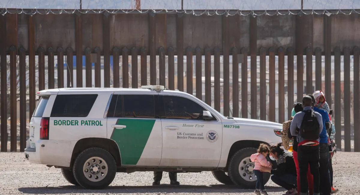 Border Patrol agents apprehend a group of illegal immigrants following the congressional border delegation visit near downtown El Paso, Texas, on March 15, 2021. (Justin Hamel/AFP via Getty Images)