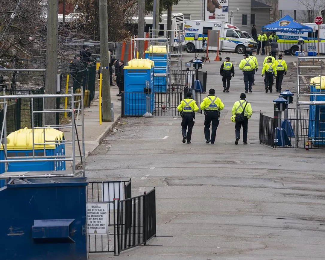 Police patrol the empty streets of Waterloo, Ont. on St. Patrick's Day on March 17, 2020. It's St. Patrick's Day but the pandemic is taking at least some of the fizz out of the annual Irish-themed celebration. Restrictions on gatherings abound and officials across Canada are urging restraint. (Frank Gunn / The Canadian Press)