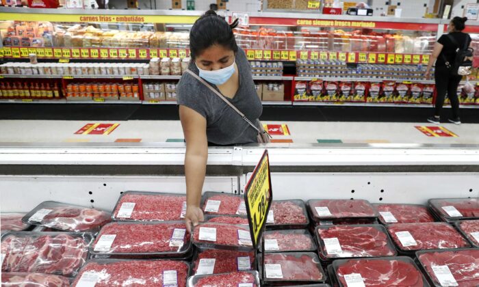 A shopper looks over meat products at a grocery store in Dallas, Texas, on April 29, 2020. (LM Otero/AP Photo)
