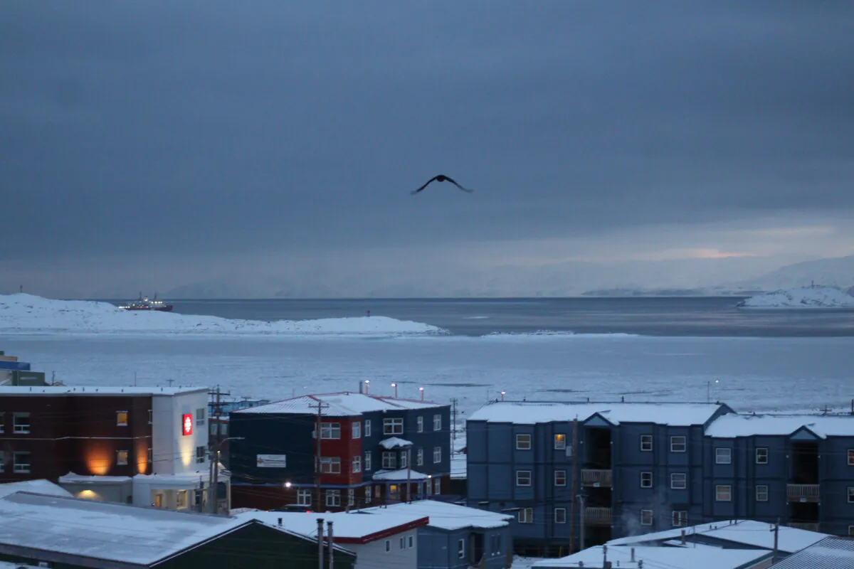 Downtown Iqaluit, Nunavut, is shown after 2 p.m. sunset on Nov. 24, 2020. (The Canadian Press/Emma Tranter)