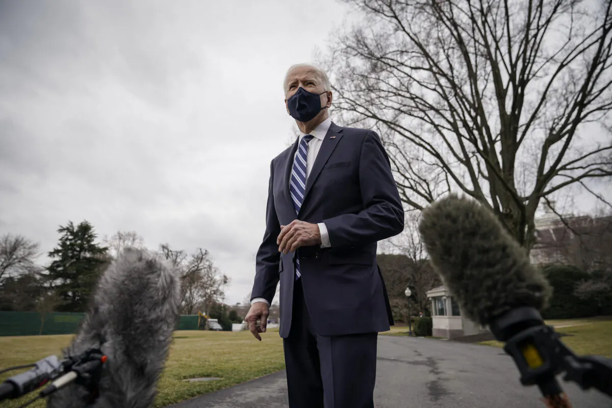 President Joe Biden stops briefly to talk to the press as he walks toward Marine One on the South Lawn of the White House in Washington on March 16, 2021. (Drew Angerer/Getty Images)