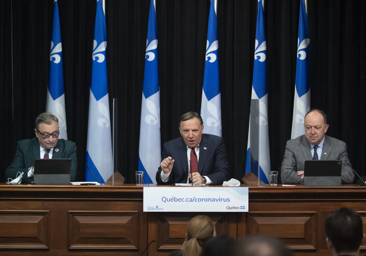 Quebec Premier Francois Legault (C) speaks at a news conference on the COVID-19 pandemic on March 16, 2021, at the legislature in Quebec City. (Jacques Boissinot/The Canadian Press)