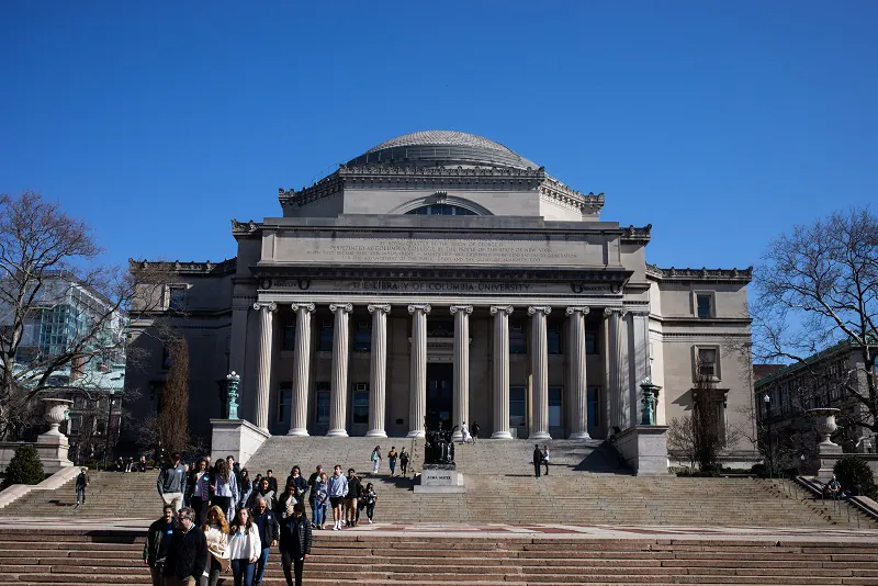 People walk on the Columbia University campus in New York City on March 9, 2020. (Jeenah Moon/Getty Images)