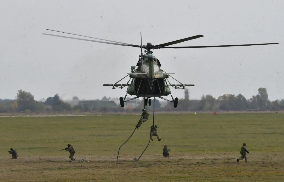 Ukrainian troops land from Mi-8 helicopter, built with Motor Sich's engines, during an air force exercises in western Ukraine on Oct. 12, 2018. (Genya Savilov/AFP via Getty Images)