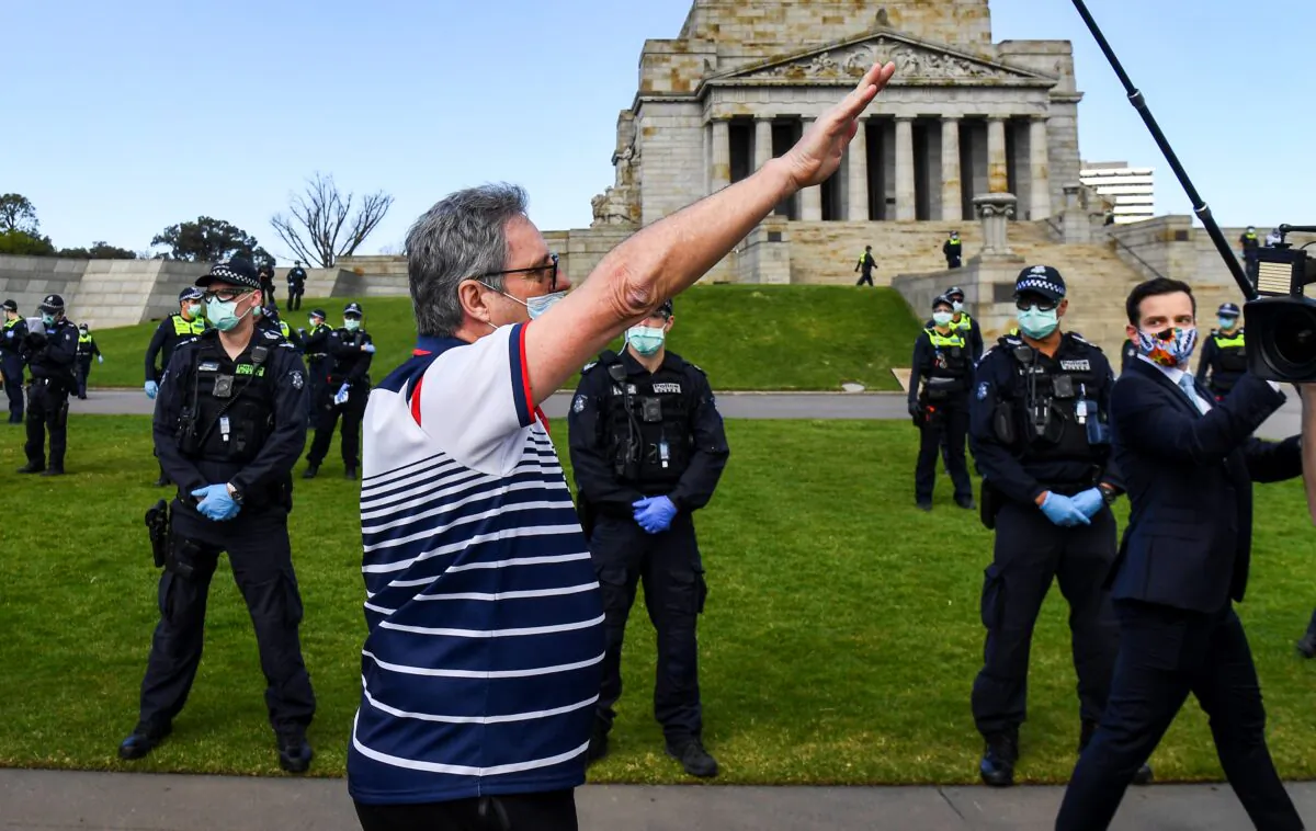 A protester performs a Nazi salute at the Shrine of Remembrance in Melbourne on Sept. 5, 2020 during an anti-lockdown rally (William West/AFP via Getty Images)