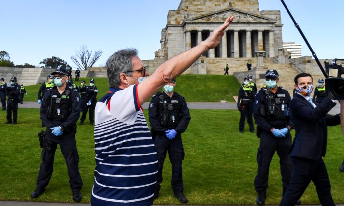 A protester performs a Nazi salute at the Shrine of Remembrance in Melbourne on Sept. 5, 2020 during an anti-lockdown rally (William West/AFP via Getty Images)
