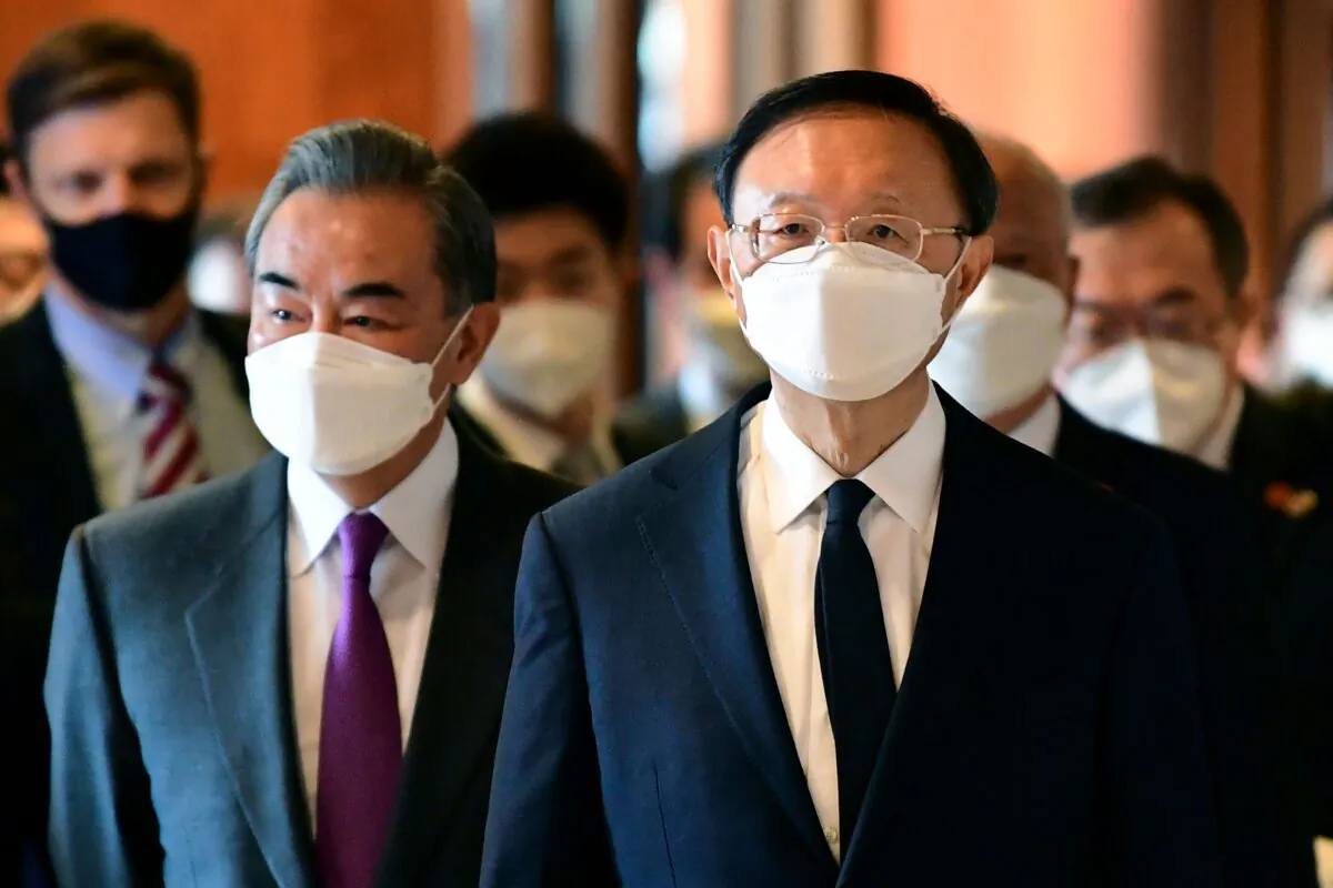 Yang Jiechi (R), director of the Central Foreign Affairs Commission Office for China and Wang Yi (L), China's Foreign Minister arrive for a meeting with U.S. counterparts at the opening session of U.S.-China talks at the Captain Cook Hotel in Anchorage, Alaska on March 18, 2021. (Fredrick J. Brown/POOL/AFP via Getty Images)
