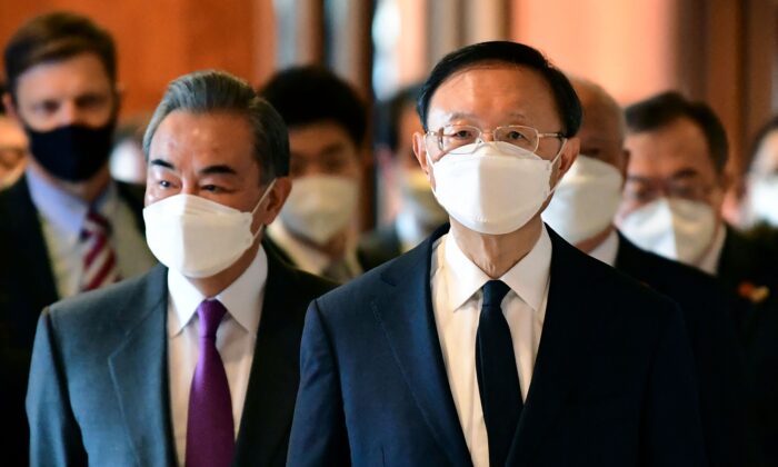 Yang Jiechi (R), director of the Central Foreign Affairs Commission Office for China, and Wang Yi (L), China's Foreign Minister, arrive for a meeting with U.S. counterparts at the opening session of U.S.–China talks at the Hotel Captain Cook in Anchorage, Alaska, on March 18, 2021. (Fredrick J. Brown/Pool/AFP via Getty Images)