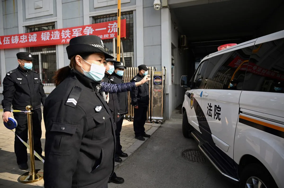 A police vehicle arrives at the side entrance of the Dandong Intermediate People's Court, where Canadian businessman Michael Spavor will be on trial, in the border city of Dandong in China's northeast Liaoning province on March 19, 2021. (Noel CelisS/AFP via Getty Images)