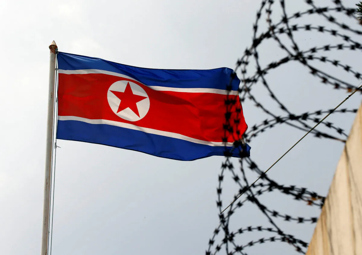 The North Korea flag flutters next to concertina wire at the North Korean embassy in Kuala Lumpur, Malaysia, on March 9, 2017. (Edgar Su/Reuters)
