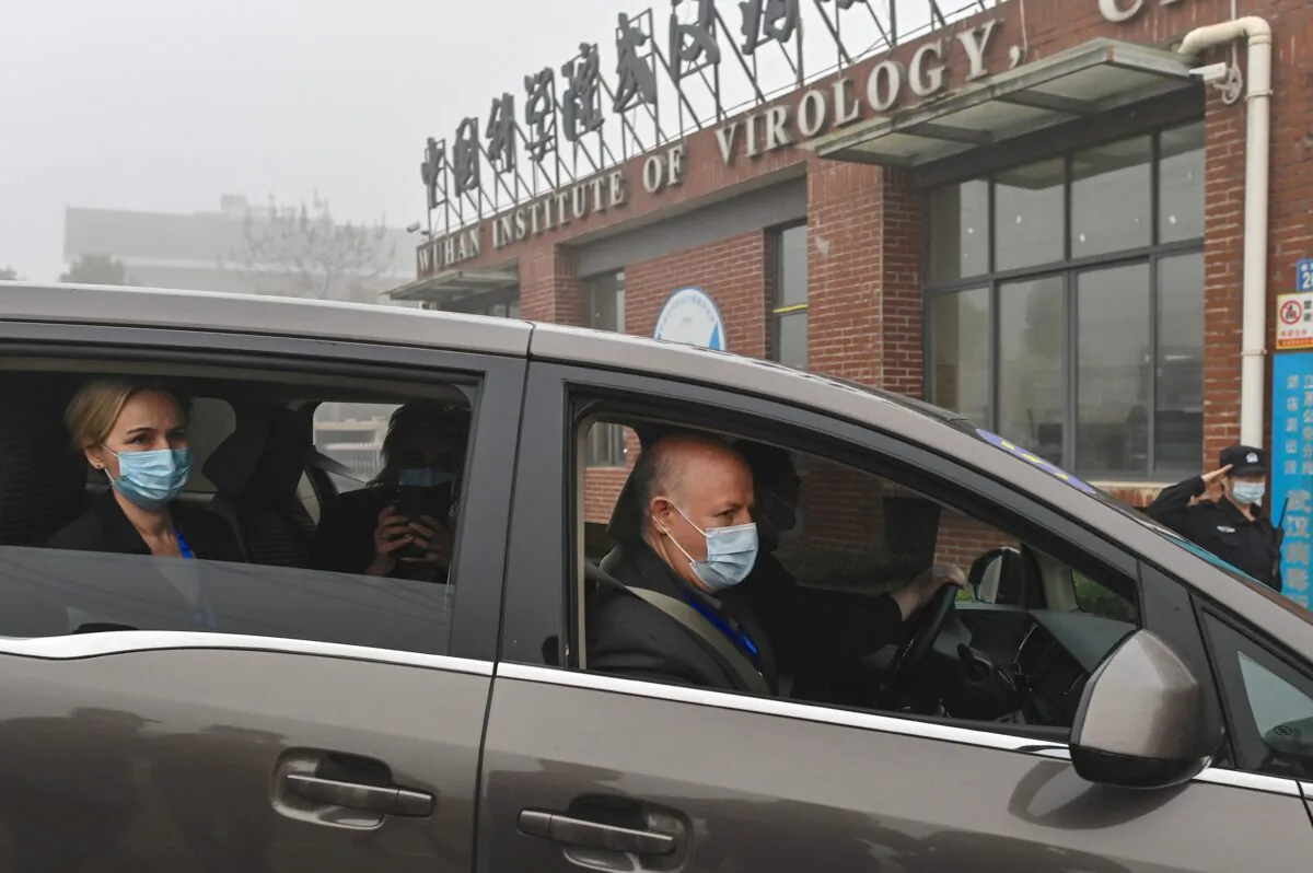 Peter Daszak (R) and other members of the World Health Organization (WHO) team investigating the origins of the COVID-19 coronavirus, arrive at the Wuhan Institute of Virology on Feb. 3, 2021. (Hector Retamal/AFP via Getty Images)