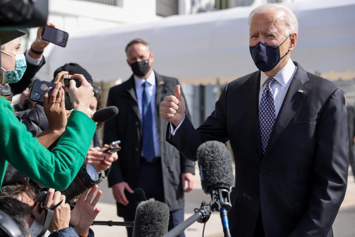 President Joe Biden talks to reporters as he departs the White House in Washington on March 19, 2021. (Jonathan Ernst/Reuters)