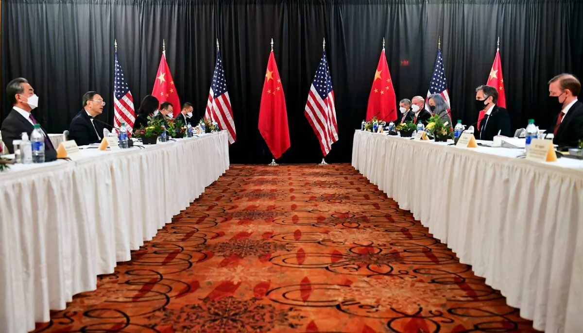 U.S. Secretary of State Antony Blinken (2nd R), joined by National Security Adviser Jake Sullivan (R), speaks while facing Yang Jiechi (2nd L), director of the Central Foreign Affairs Commission Office, and Wang Yi (L), China's State Councilor and Foreign Minister, at the opening session of U.S.–China talks at the Captain Cook Hotel in Anchorage, Alaska, on March 18, 2021. (Frederic J. Brown/Reuters)