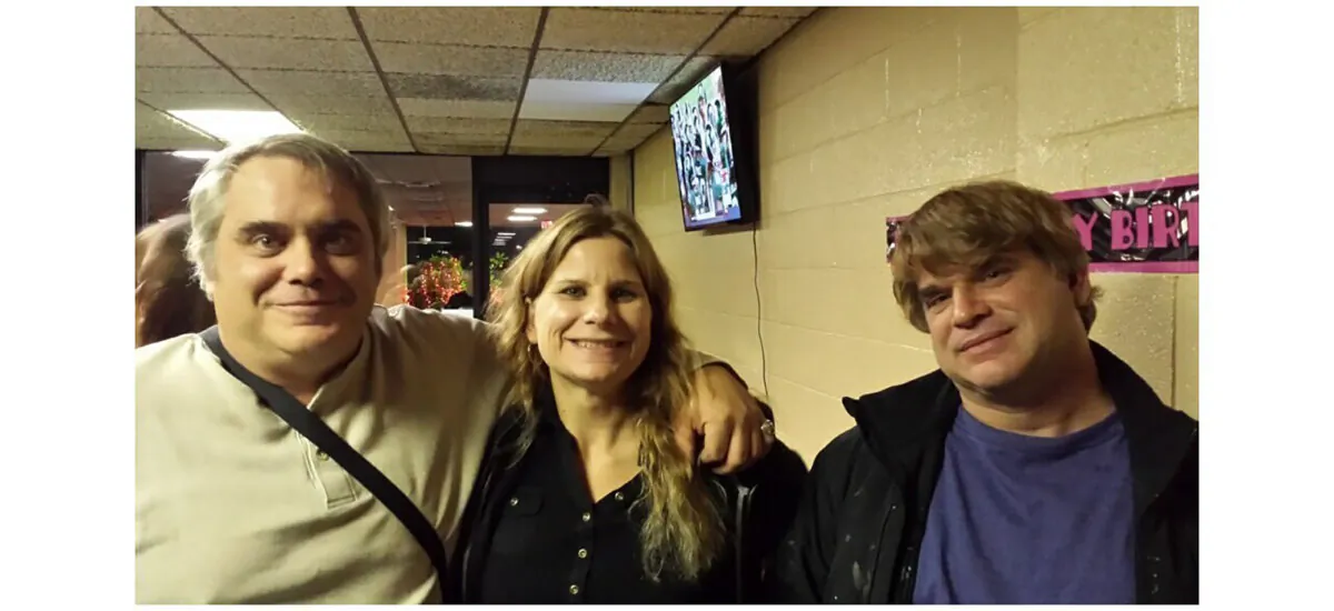 This photo provided by John Michels (L) shows his brother Paul Andre Michels (R) posing with his sister Sarah Michels and himself, in Allen Park, Mich., in October 2015. (John Michels via AP)